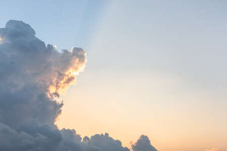 Clear blue sky in morning before raining with golden sunlightの写真素材