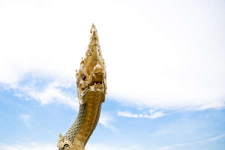 serpent king or naga statue and blue skyの写真素材
