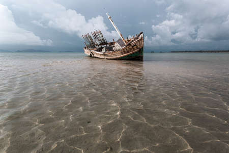 Abandoned wrecked ship in seaside