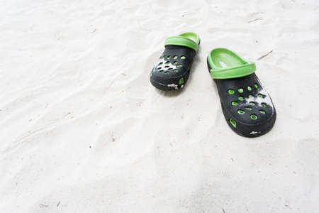 Beach sandals on the white sand beachの写真素材
