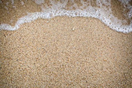 Closeup  sand and mini wave for input some text messageの写真素材