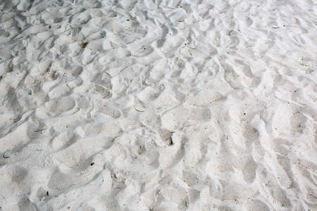 sand texture with many foot printの写真素材