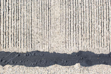 black asphalt with cement background  for input some text messageの写真素材