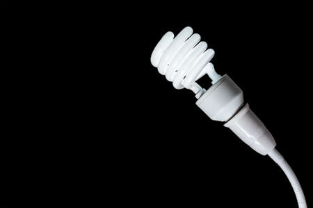 fluorescent light bulb isolated on a black bakground
