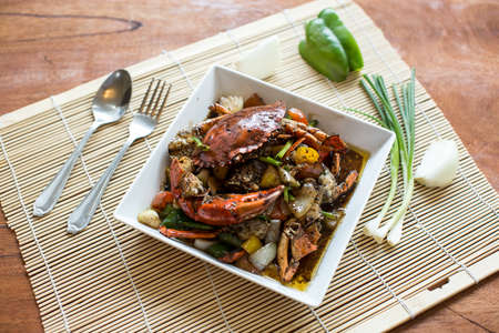 fried crab with black pepper set on dishの写真素材