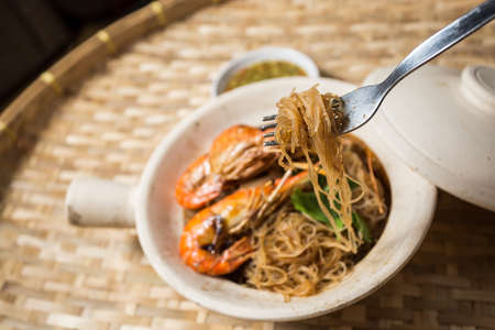 Casseroled prawns with vermicelli in clay potの写真素材