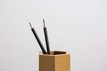 wooden Box  tube with  pencils, on white backgrounf