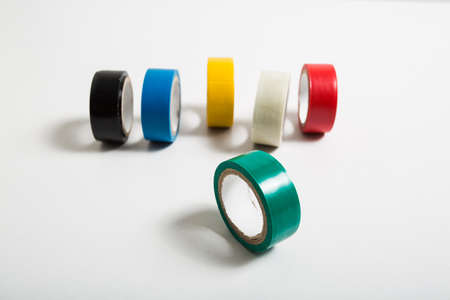 selective focus green insulating tape roll isolated on white backgroundの写真素材
