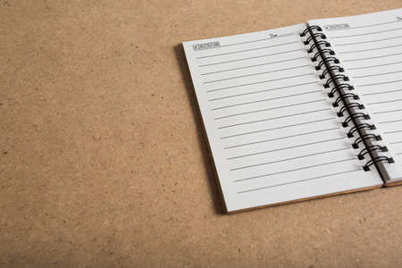 blank notebook on wooden table