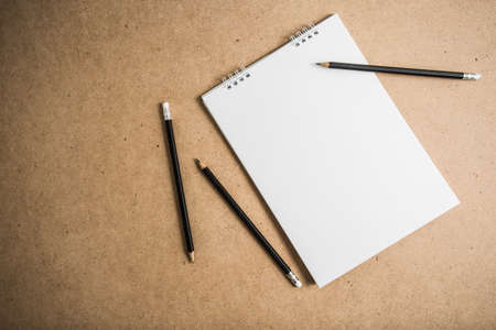 blank notebook on wooden table