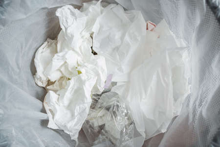 Recycle. Crumpled paper and plastic in the trash can