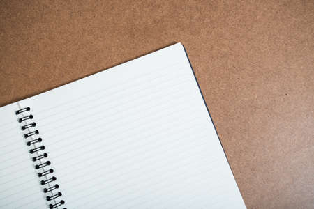 blank notebook with pen on wooden tableの写真素材