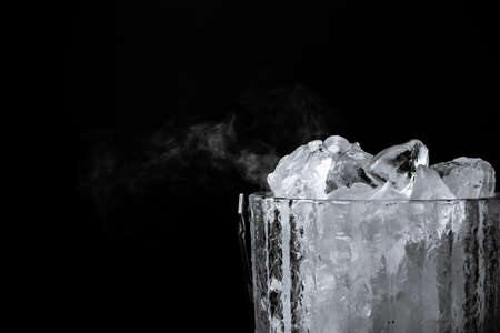 crystal bucket with ice on a dark backgroundの写真素材