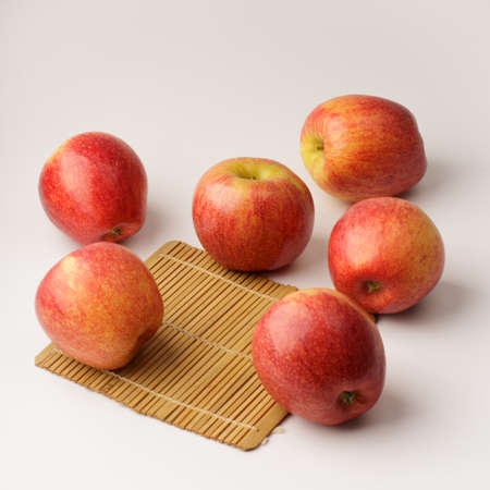 Red Organic Envy Apples Ready to Eat on white backgroundの写真素材