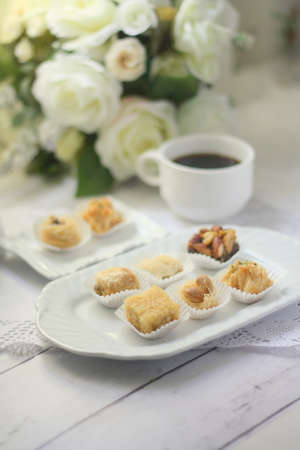 Middle east dessert with a cup of coffeeの写真素材