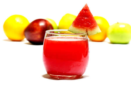 Fresh watermelon juice in glass with fresh fruits backgroundの写真素材