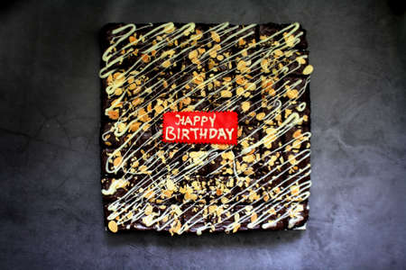 Square cuts brownies top view with dark backgroundの写真素材