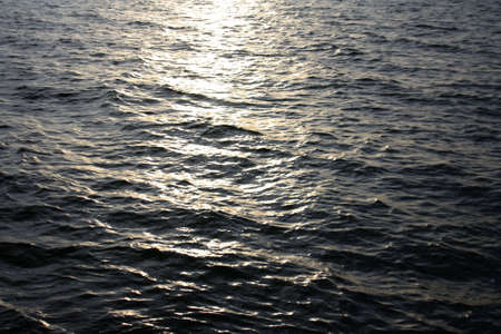 Water wave surface with light reflectionの写真素材