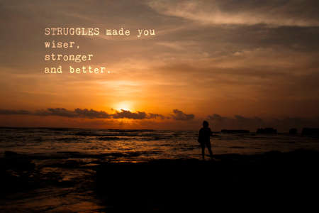 Struggles made you wiser, stronger and better - Motivation and encouragement message. Sunset and one person silhouette.の写真素材