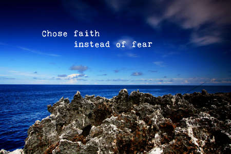 Choose faith instead of fear - Motivation and positive messages on blue landscapeの写真素材