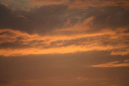 Orange color sky and cloud for background useの写真素材