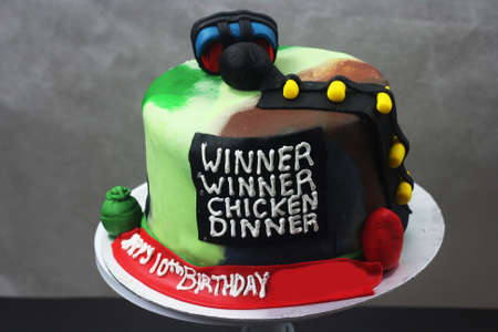 game inspired cake with writing "winner winner chicken dinner"の写真素材