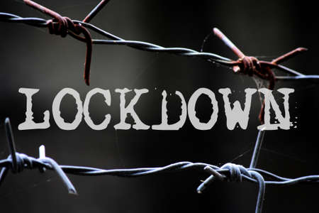 LOCKDOWN wording conceptual with barb wire spike backgroundの写真素材