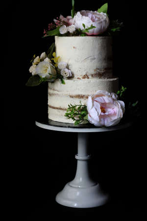 Beautiful Wedding Cake two tier on black dark background for bakery or inspirationの写真素材