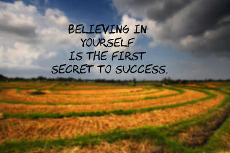 Believing in  yourself  is the first  secret to success. - motivation and inspirational quotes with landscape blur backgroundの写真素材