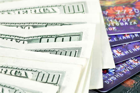 plastic cards and paper dollars background or texture
