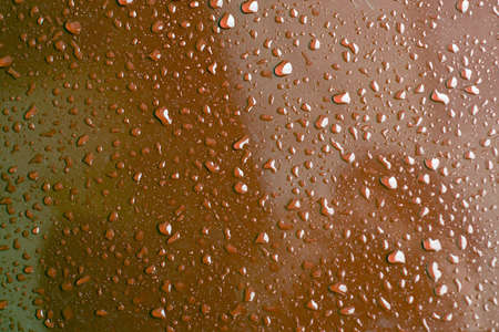 Water Drops on the red surfaceの写真素材