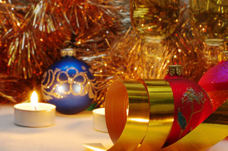 The burning candles, balls and gold ribbons it are Christmasの写真素材
