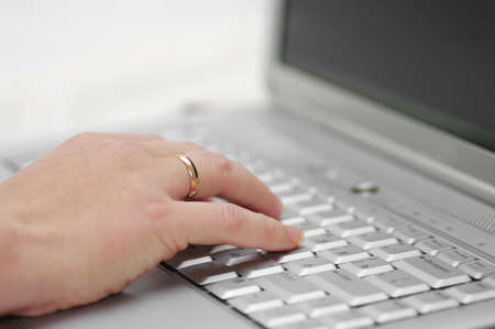 selective focus hand on alptopの写真素材