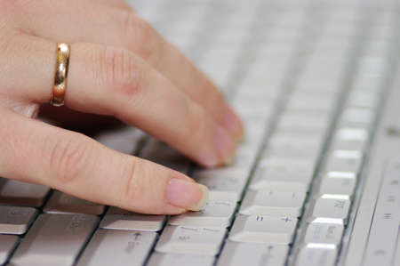 selective focus hand on keyboard