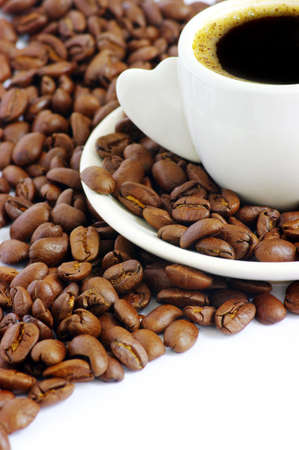 Coffee cup and grain on whiteの写真素材