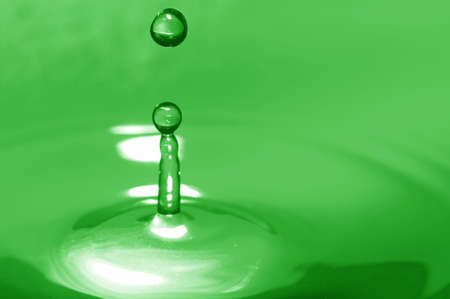 Water splash. Green color of splash.