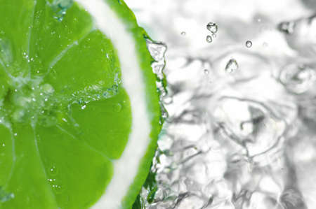 fresh water drops on lemon. Green lime