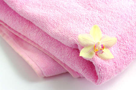flower of orchid on spa towelの写真素材