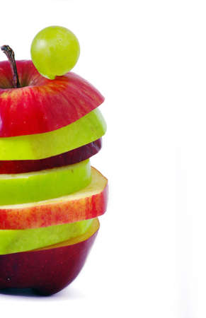 Apple slices made up of red and green on top of each other. の写真素材