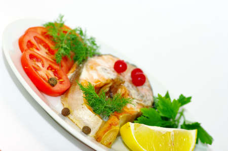 grilled fish with vegetables and spices on the white background
の写真素材