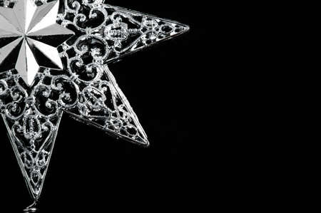 Decorative christmas star - isolated on black background.
の写真素材