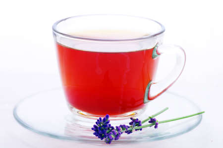 cup of herbal tea with flowers isolated on white の写真素材