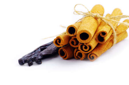 cinnamon and vanilla isolated over white background の写真素材