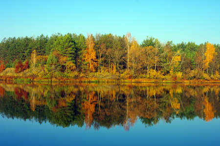 Picturesque autumn landscape on the river の写真素材