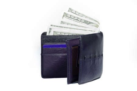 US dollars in a black wallet isolated on white background