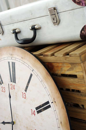 Vintage white suitcase on the box with clockの写真素材