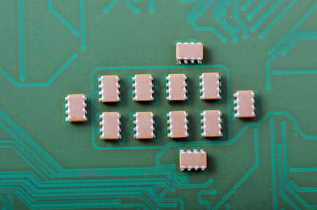 Green computer board with chips and components  