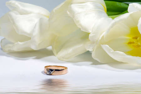 Gold ring with tulip. Gift.の写真素材