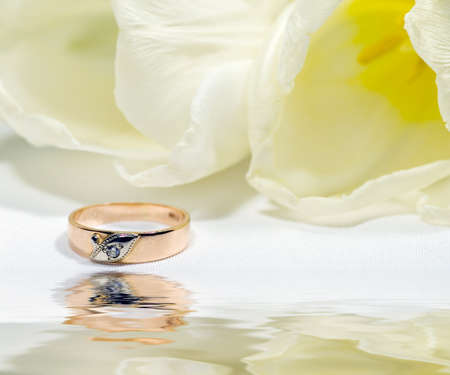 Gold ring with tulip. Gift.の写真素材