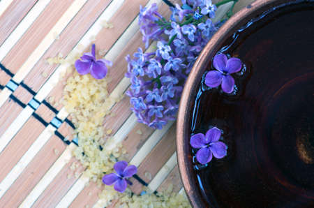 Flowers in a bowl color of brown with sea salt for SPAの写真素材